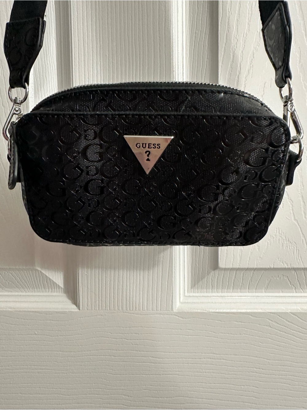 GUESS Black Embossed Logo Crossbody Bag with Silver Triangle Plaque